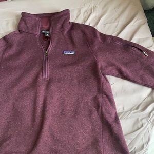 medium purple patagonia fleece sweatshirt with zipper on left upper sleeve